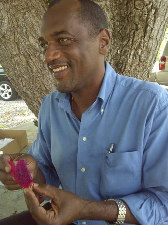 Permanent Secretary in the Ministry of Agriculture on Nevis Dr. Kelvin Daly prepares to eat during a Pitaya fruit sampling at Cades Bay
